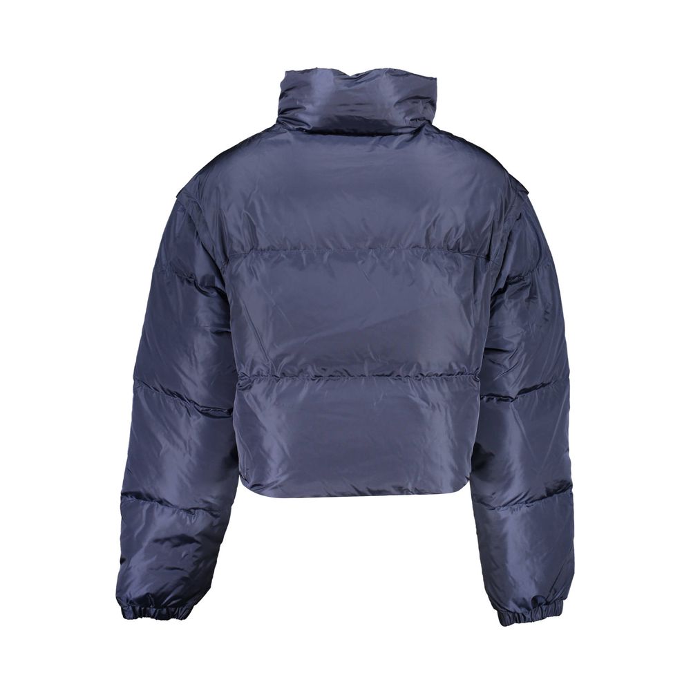 Veste en nylon bleue pour femme de Tommy Hilfiger, coupe décontractée avec fermeture éclair et col montant.