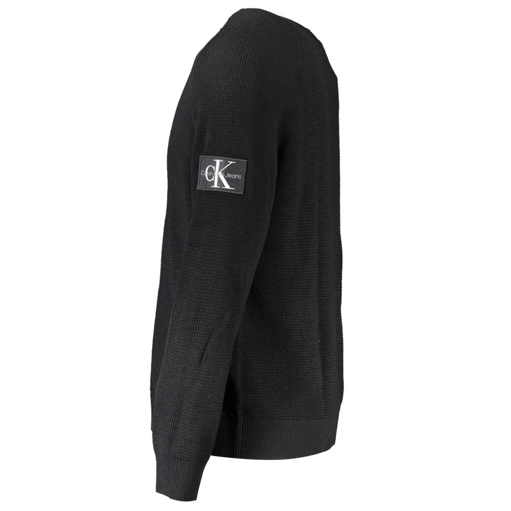 Pull pour homme Calvin Klein en laine noire, coupe classique, avec col rond et finition simple.