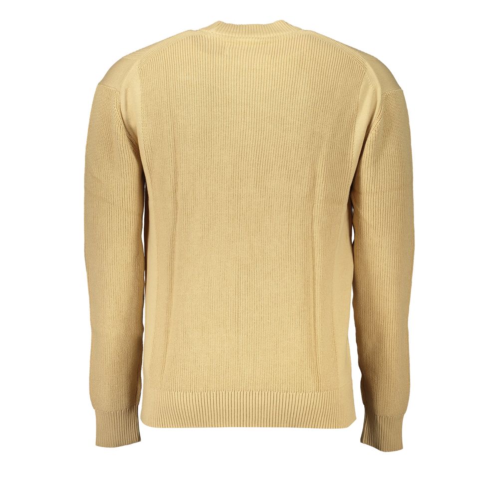 Pull homme beige en coton de la marque Calvin Klein, doux et confortable, avec col rond et finition classique.