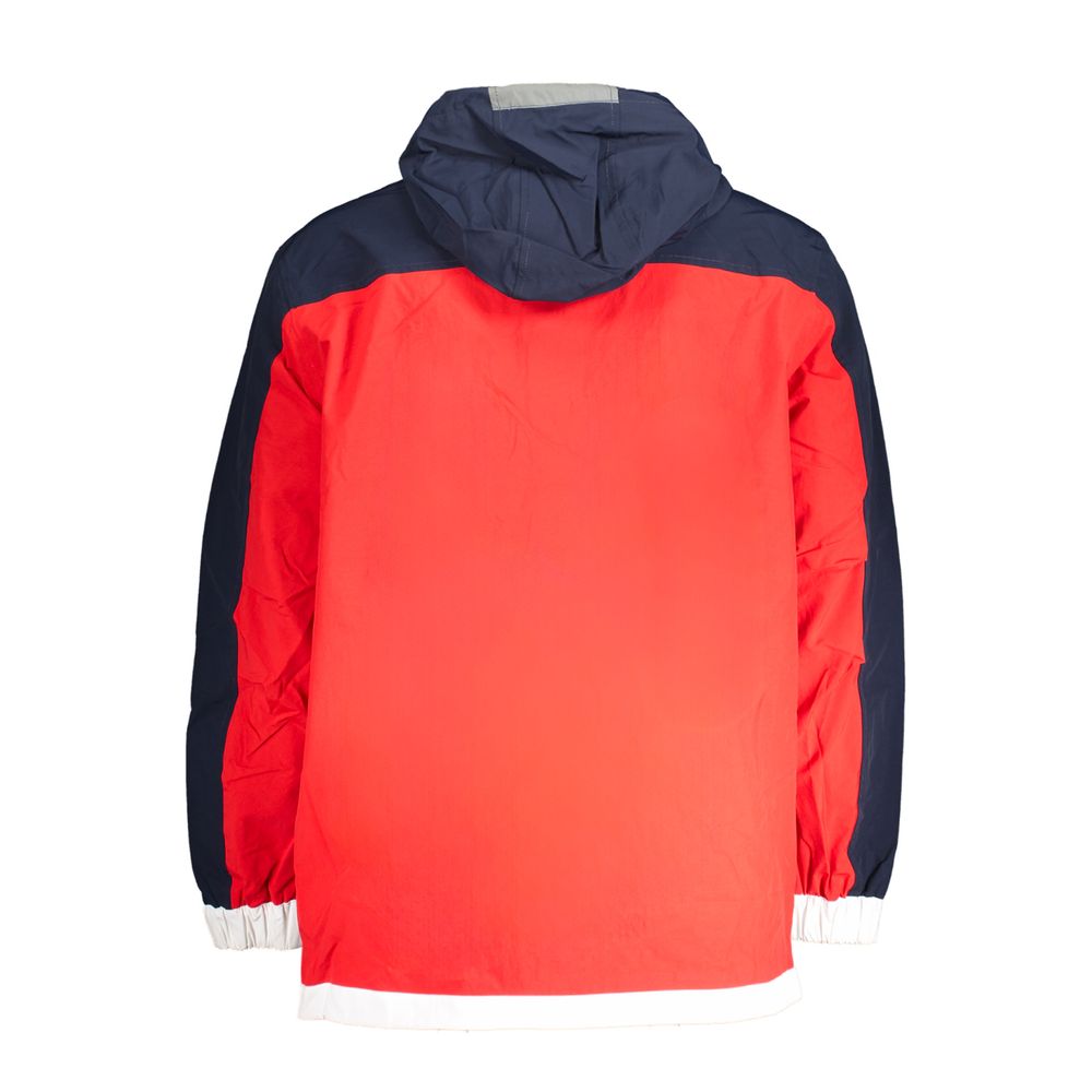 Veste en poliamide bleue pour homme de la marque Tommy Hilfiger, style moderne et tissu léger.