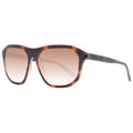 Lunettes de soleil en plastique marron Guess avec monture élégante et branches épaisses, mode tendance pour l'été.