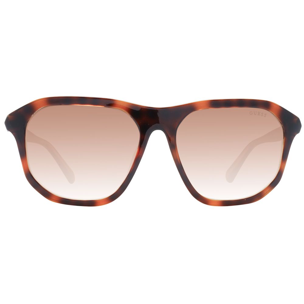 Lunettes de soleil en plastique marron Guess avec monture élégante et lentilles foncées, mode et protection solaire pour femmes.