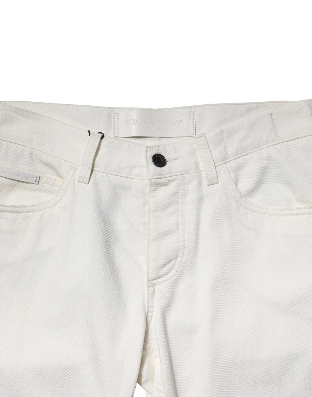Jeans homme skinny en coton blanc de Dolce & Gabbana, style denim, vue en gros plan sur le tissu et la coupe ajustée.