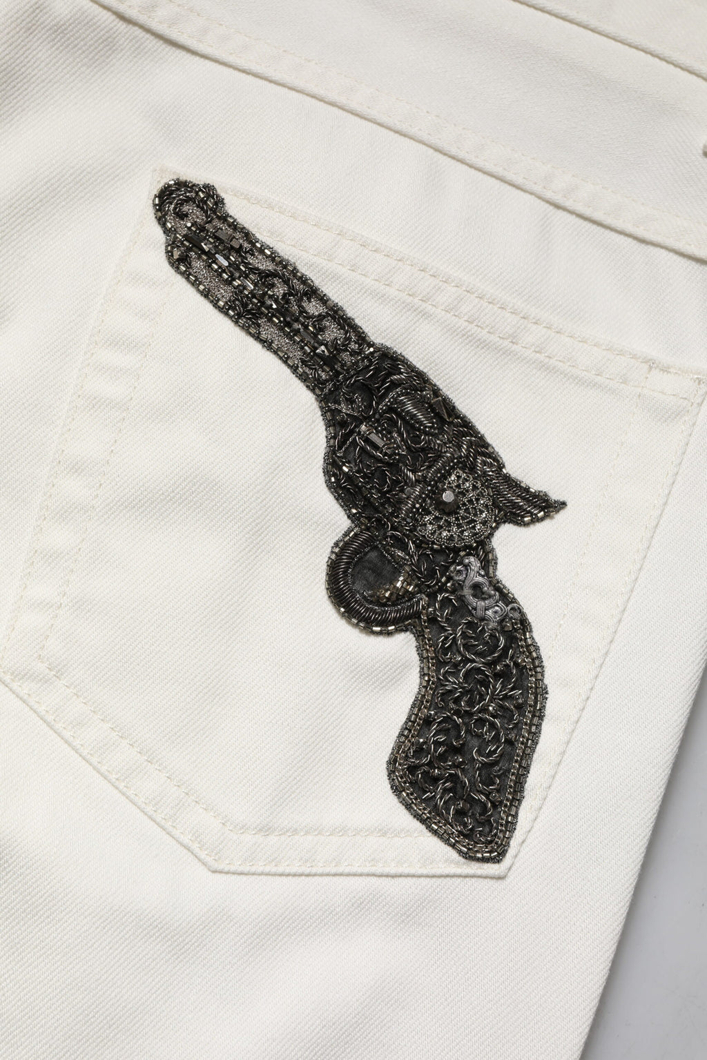 Jeans skinny en coton blanc de Dolce & Gabbana pour homme, denim ajusté avec poche arrière et détails modernes.
