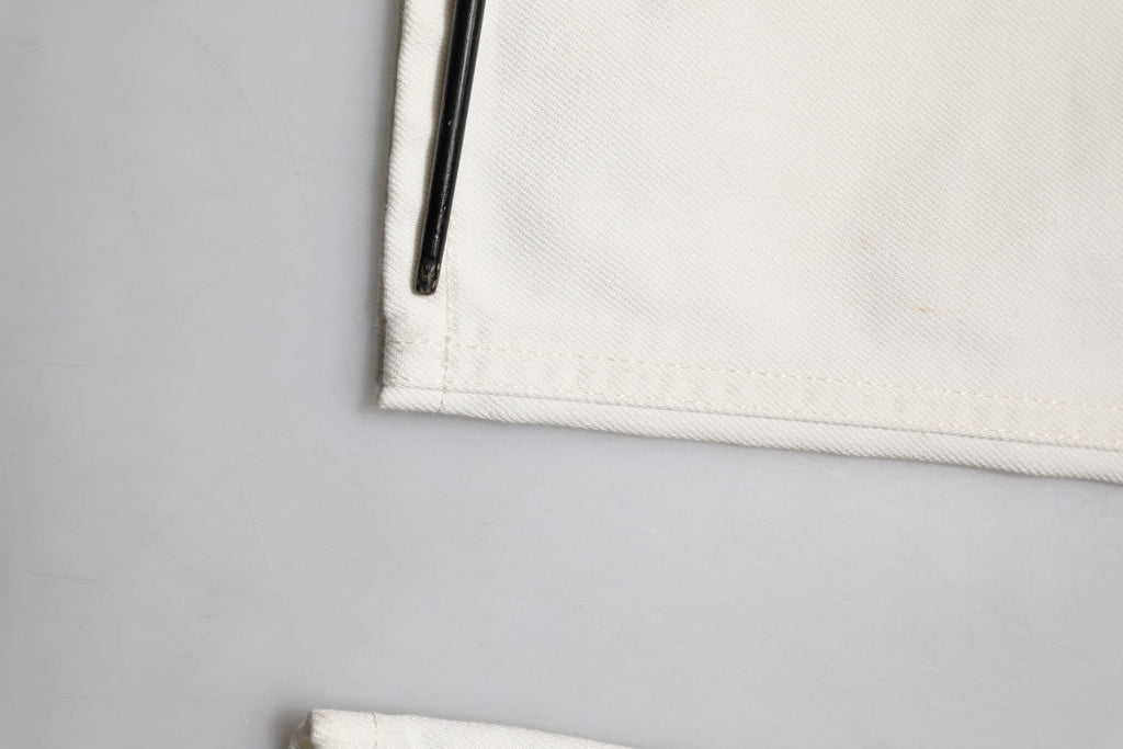 Jeans skinny en coton blanc pour homme de Dolce & Gabbana, coupe ajustée et détails modernes.
