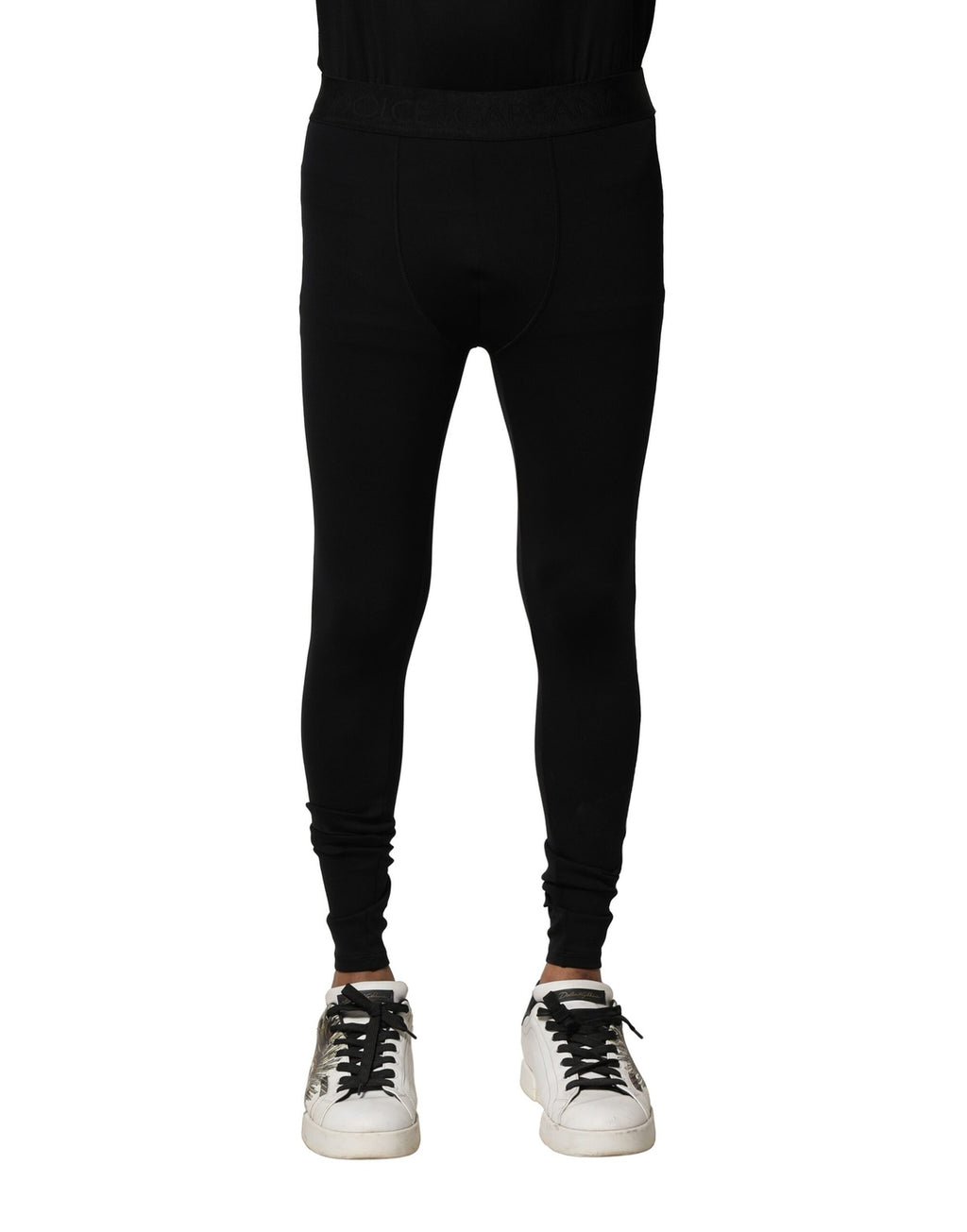 Leggings pour homme Dolce & Gabbana en nylon noir avec logo élastique, ajustés et confortables, visibles en détail sur l’image.