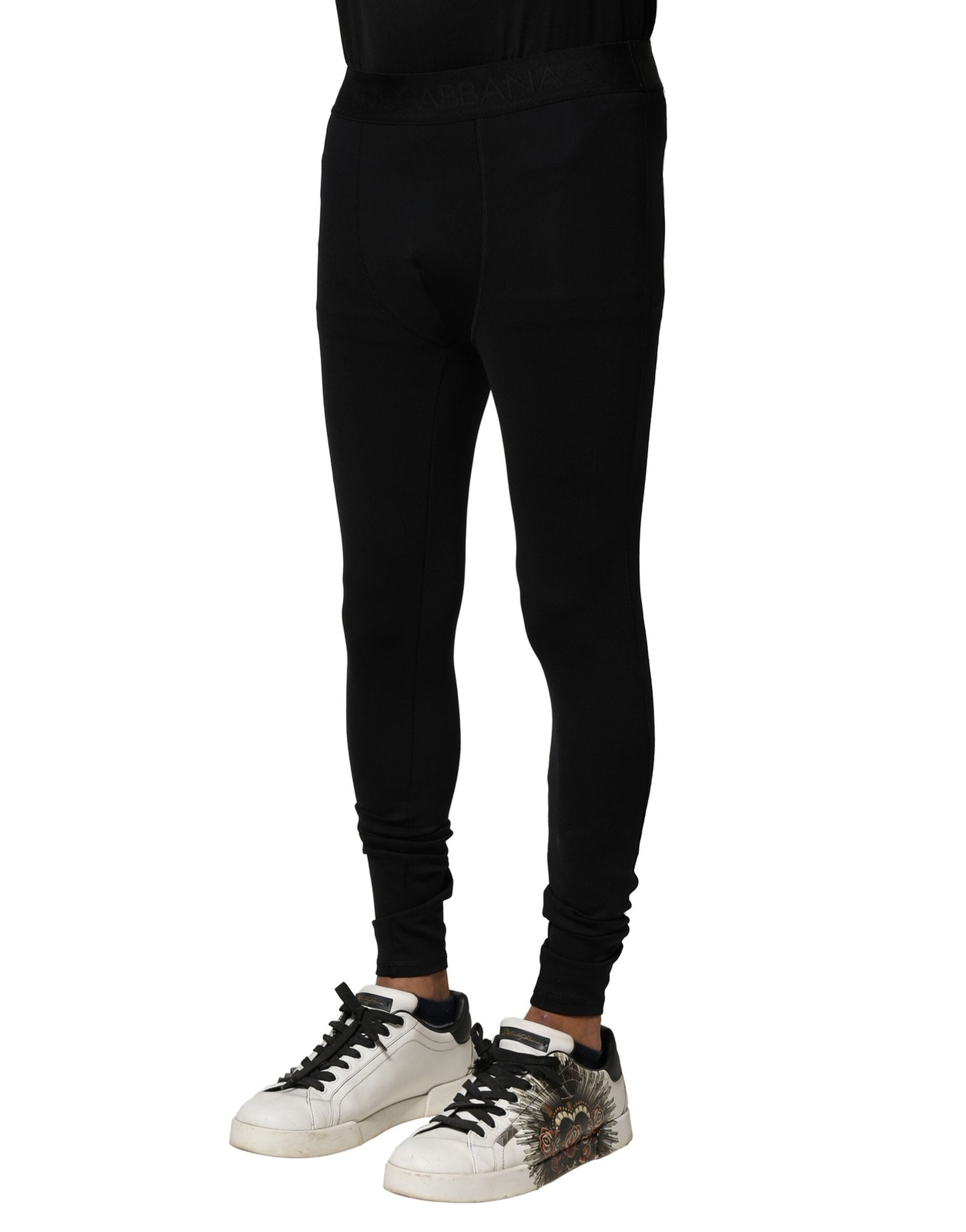 Leggings pour hommes Dolce & Gabbana en nylon noir avec logo élastique et design ajusté, visibles en détail.