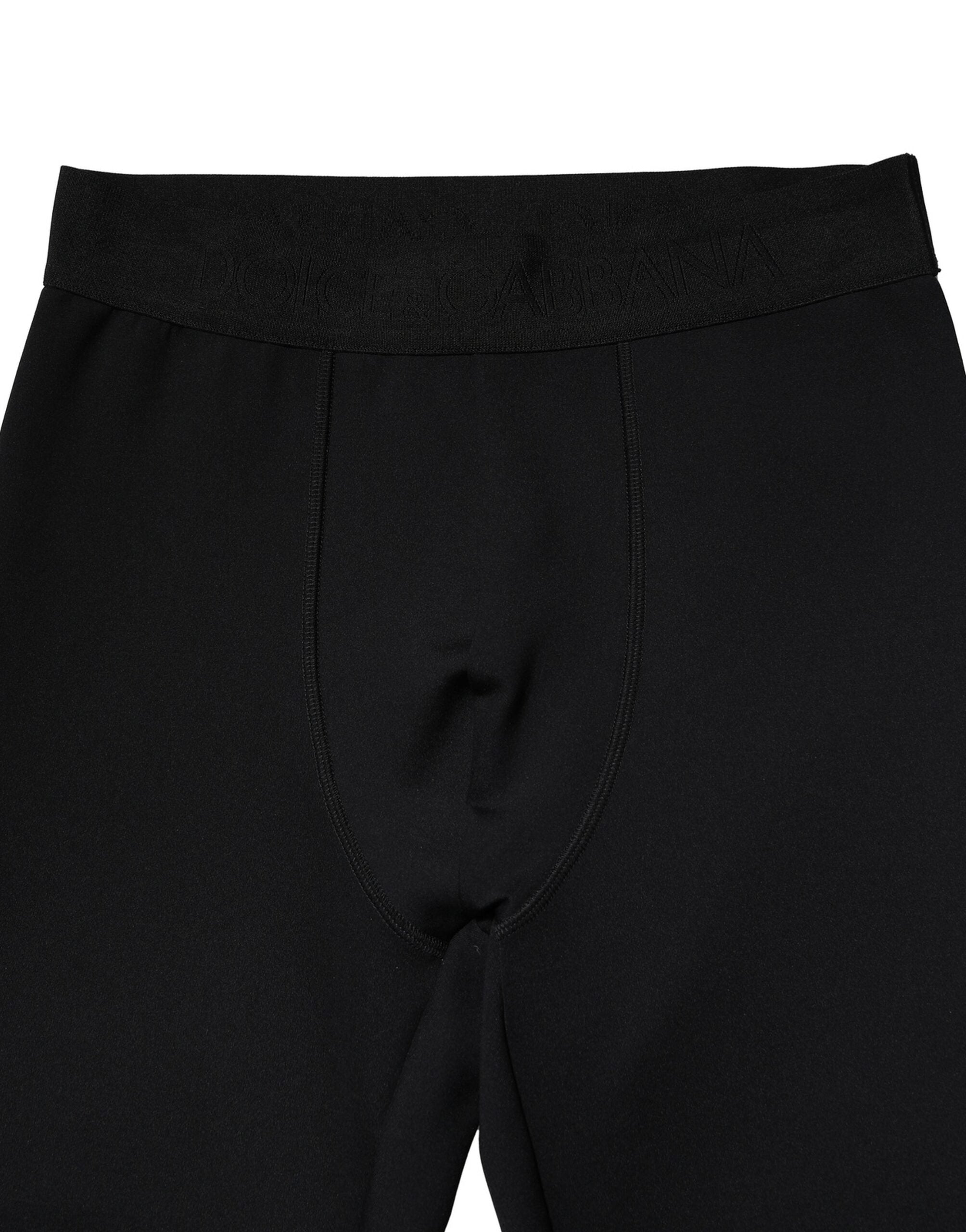Leggings pour hommes Dolce & Gabbana en nylon noir avec logo élastique, ajustés et confortables.