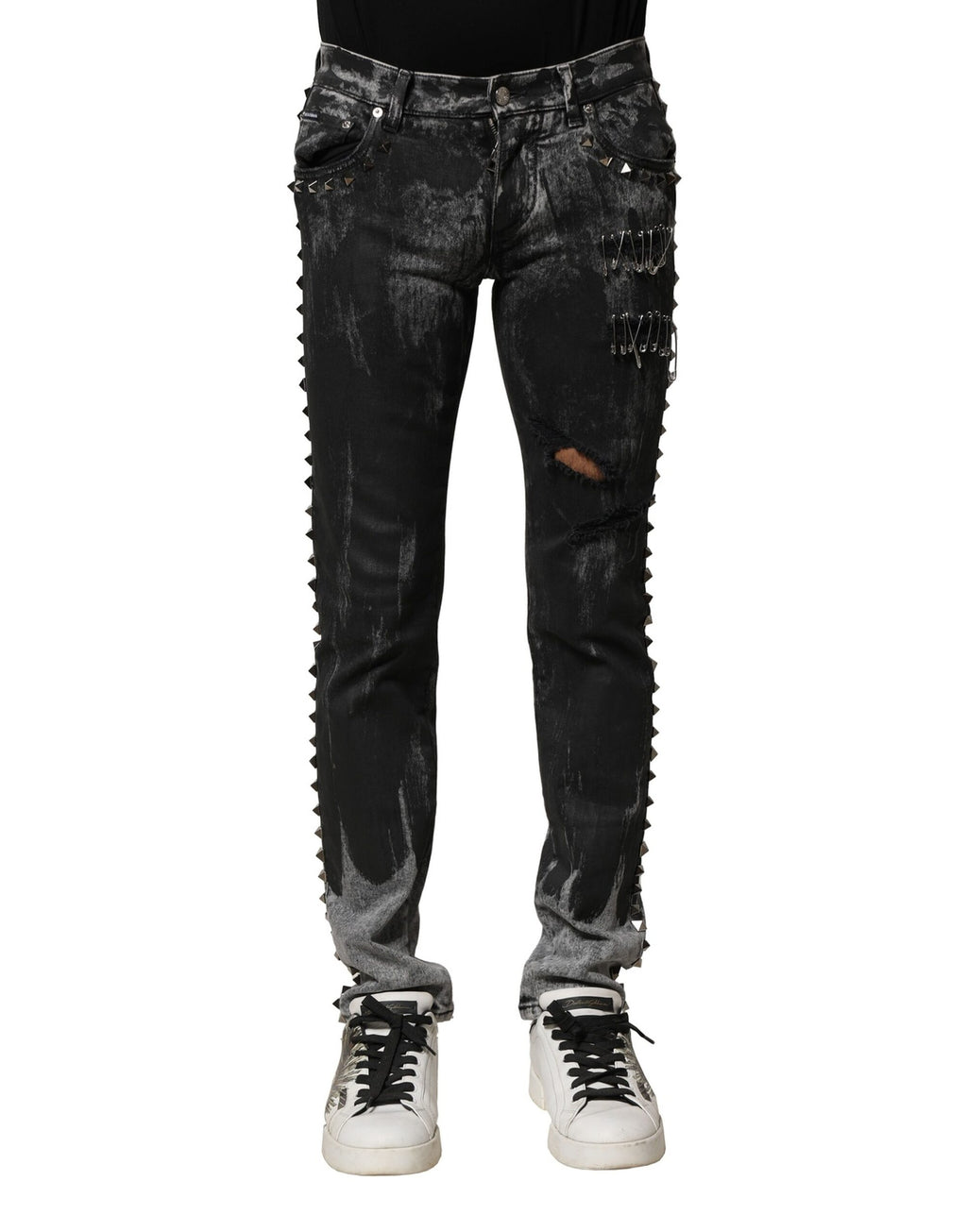 Jeans skinny en denim noir Dolce & Gabbana lavé avec embellissements visibles, coupe ajustée et détails tendance.