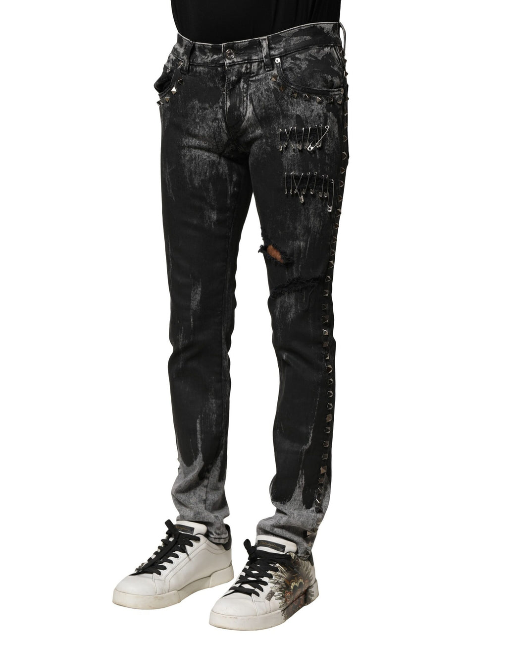Jeans skinny en denim noir lavé Dolce & Gabbana, ornés de détails embellis, visibles sur le produit.
