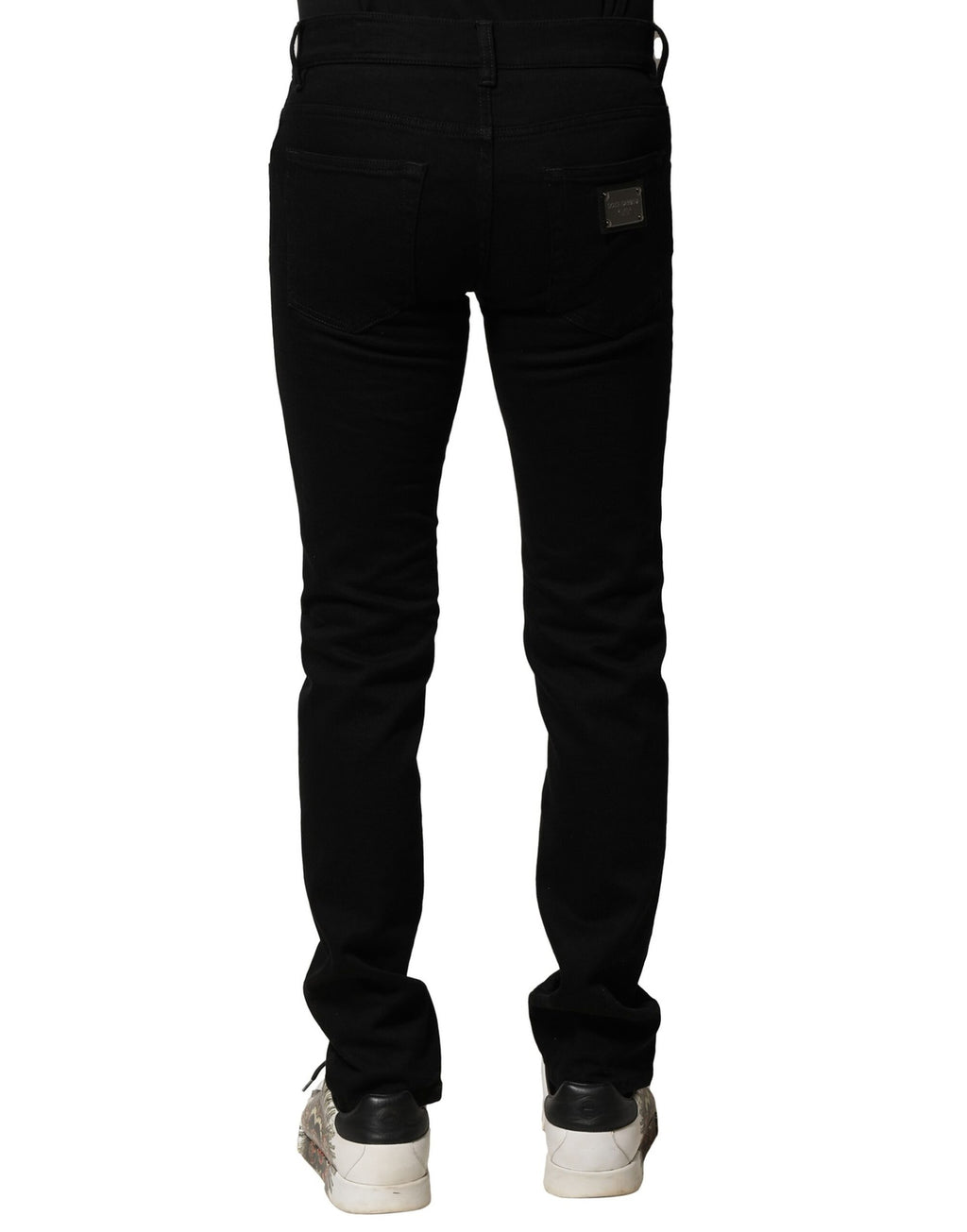 Jeans homme Dolce & Gabbana en coton stretch noir, coupe skinny, denim ajusté, visible sur l'image.