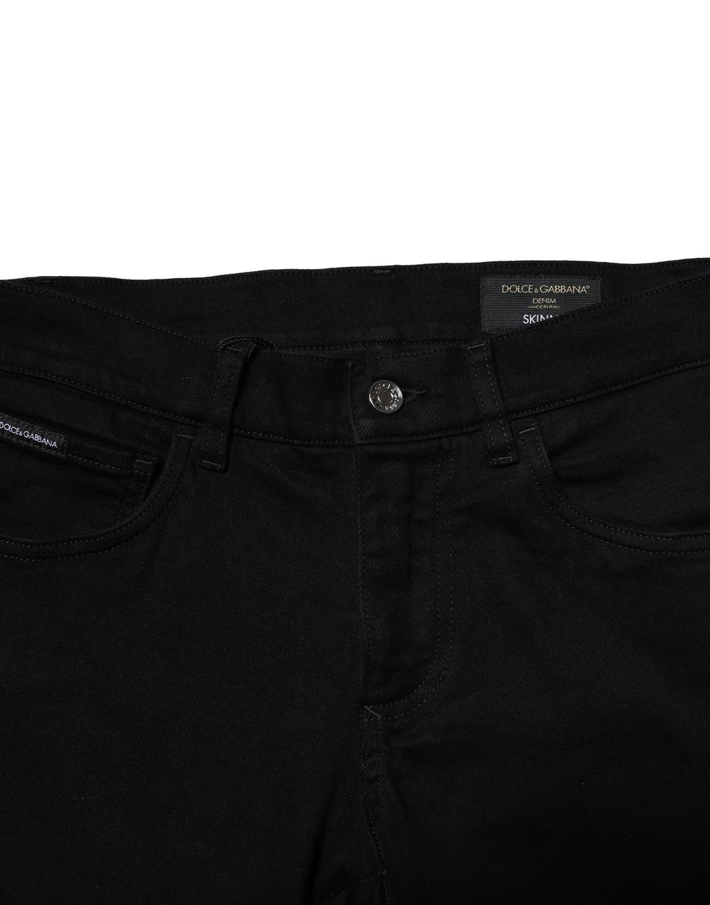 Jean homme skinny en denim noir en coton stretch de Dolce & Gabbana, vue de face sur fond blanc.
