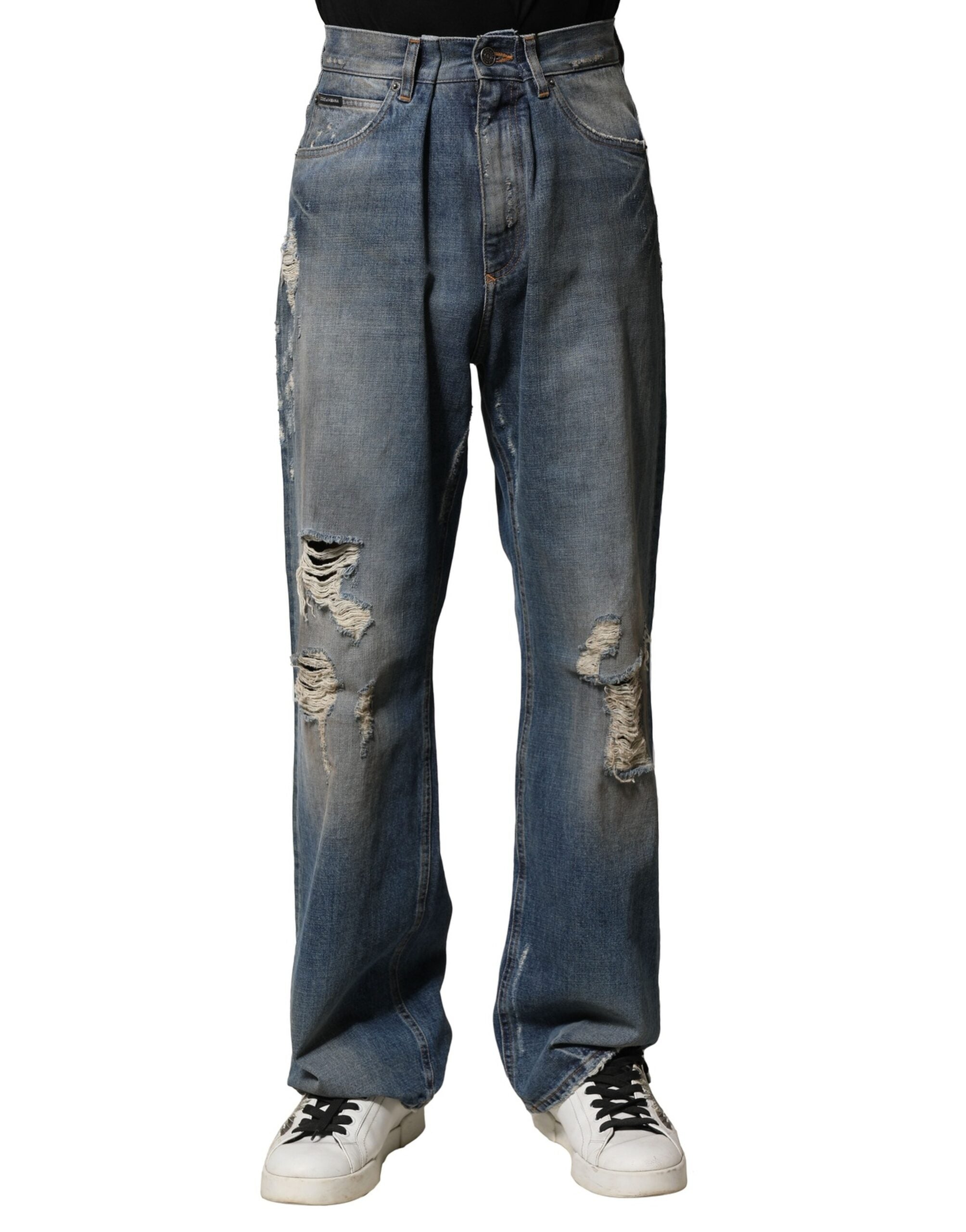 Jeans déchirés en coton bleu pour homme de Dolce & Gabbana, style décontracté avec détails usés.