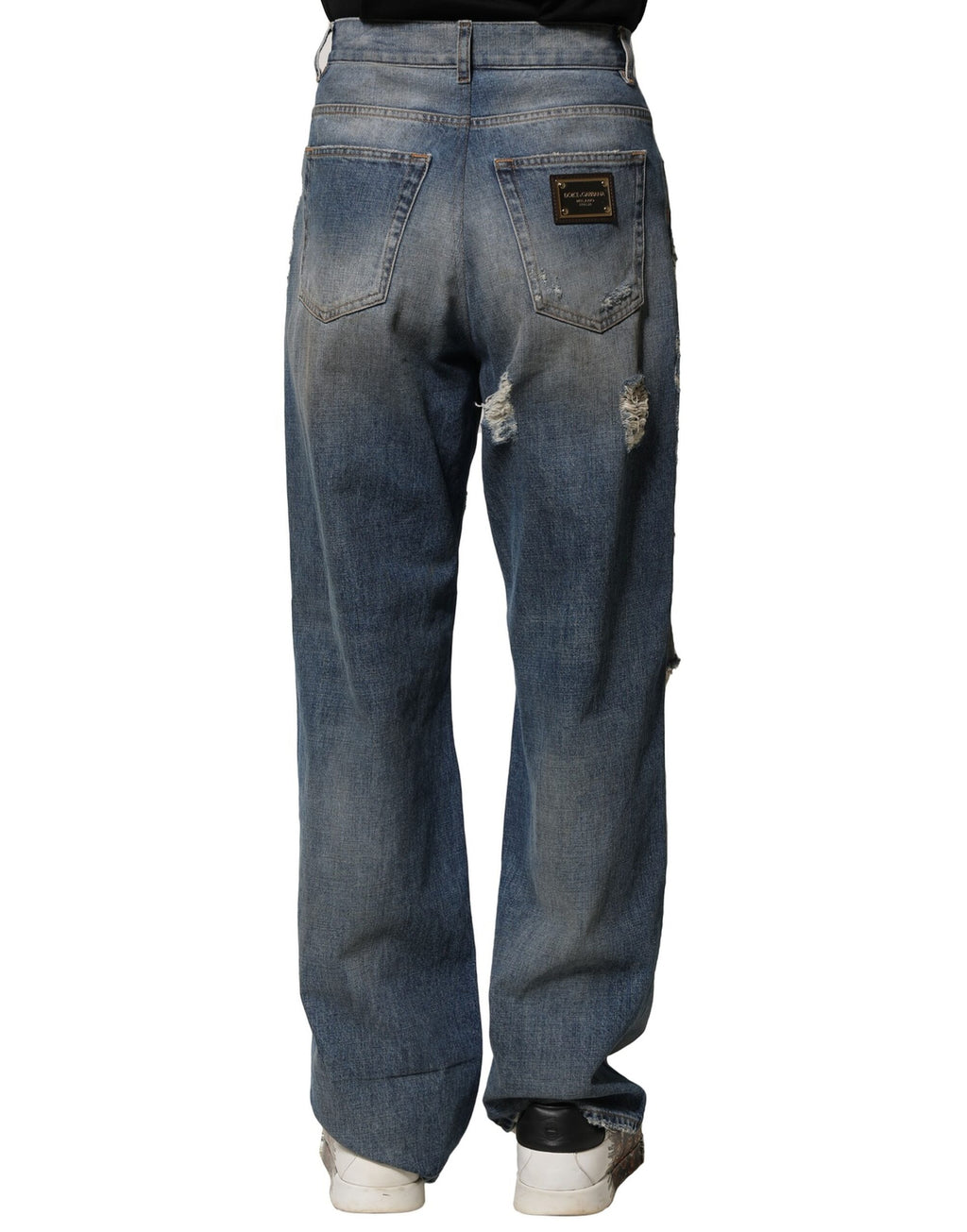 Jeans déchirés en coton bleu de Dolce & Gabbana pour homme, style décontracté avec détails usés.