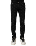 Jeans skinny en denim noir Dolce & Gabbana avec logo DG en coton pour homme, visibles avec détails de couture.