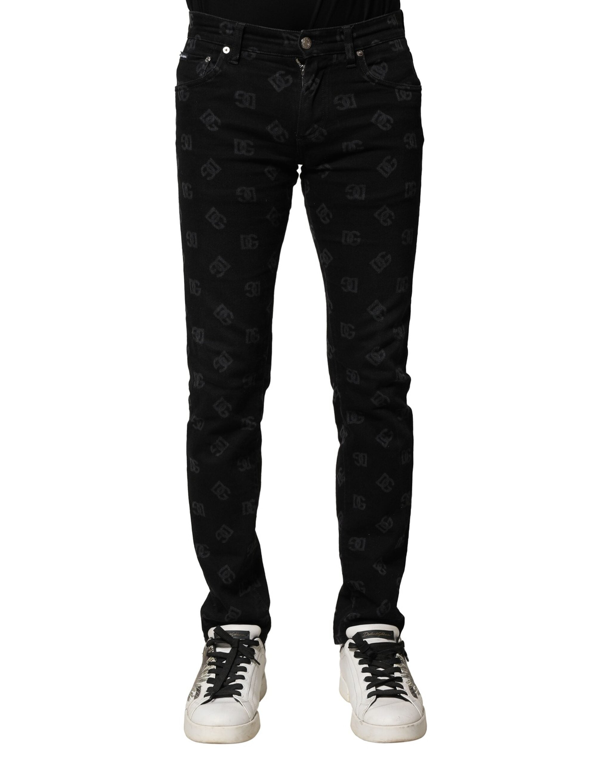 Jeans skinny en denim noir Dolce & Gabbana avec logo DG en coton pour homme, visibles avec détails de couture.