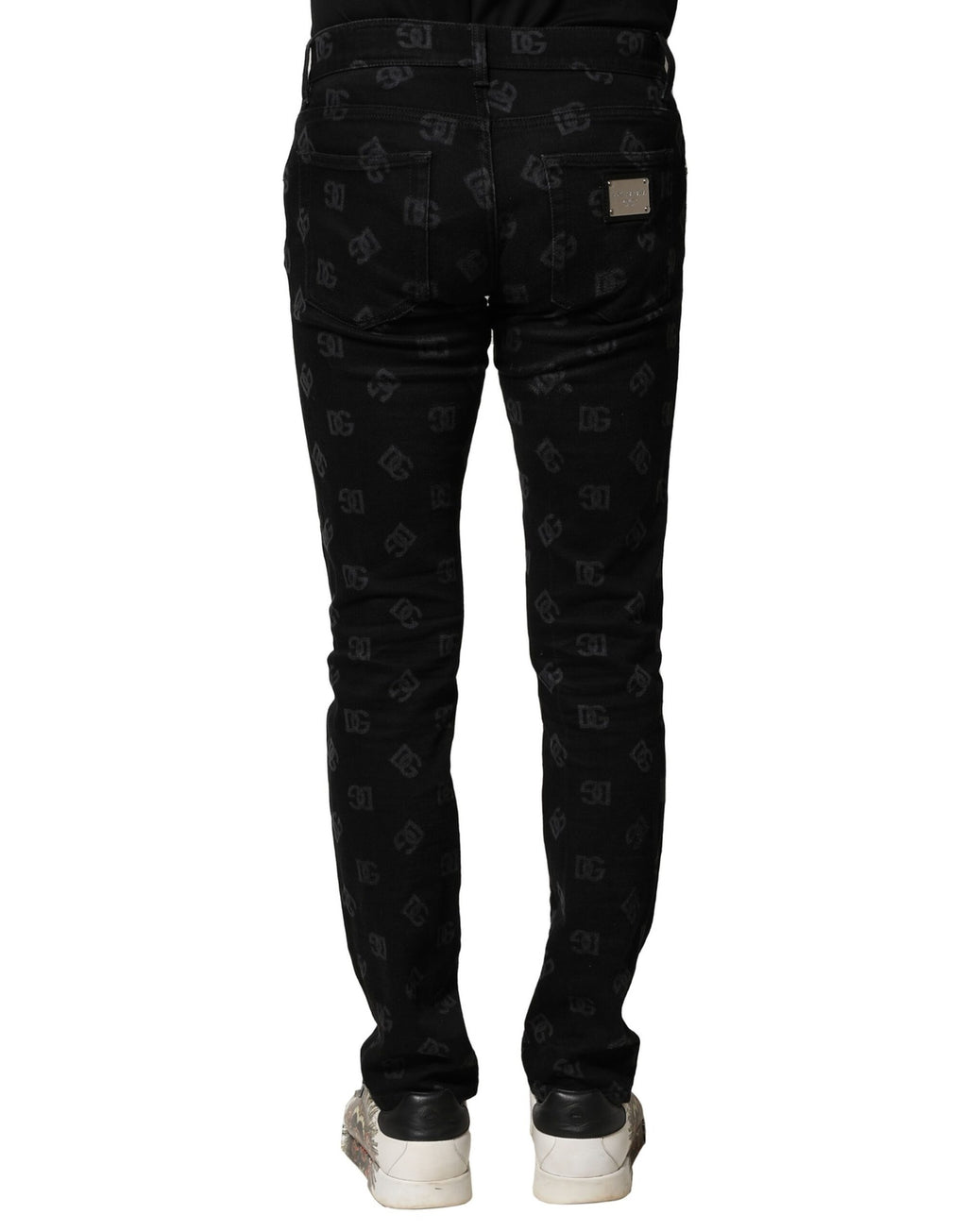 Jean homme skinny en coton noir Dolce & Gabbana avec logo DG, denim, style ajusté, visible sur le produit.