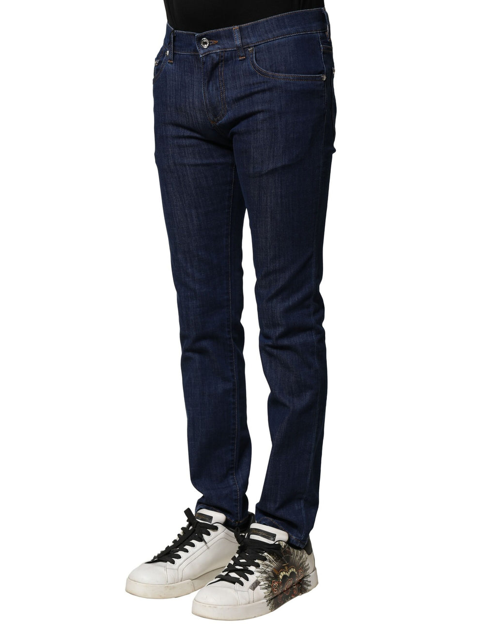 Jean homme Dolce & Gabbana en denim bleu, coupe skinny, en coton stretch, visible détail de la texture et de la fermeture éclair.
