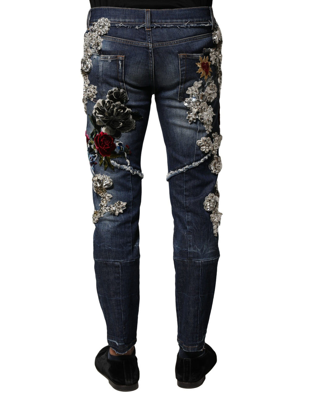 Jeans en denim bleu Dolce & Gabbana avec embellissements en strass et coton, affichant un style luxueux et tendance.