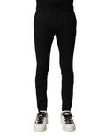 Pantalon homme skinny en laine noire Dolce & Gabbana, taille mi-haute, ajusté et élégant, porté sur un mannequin.