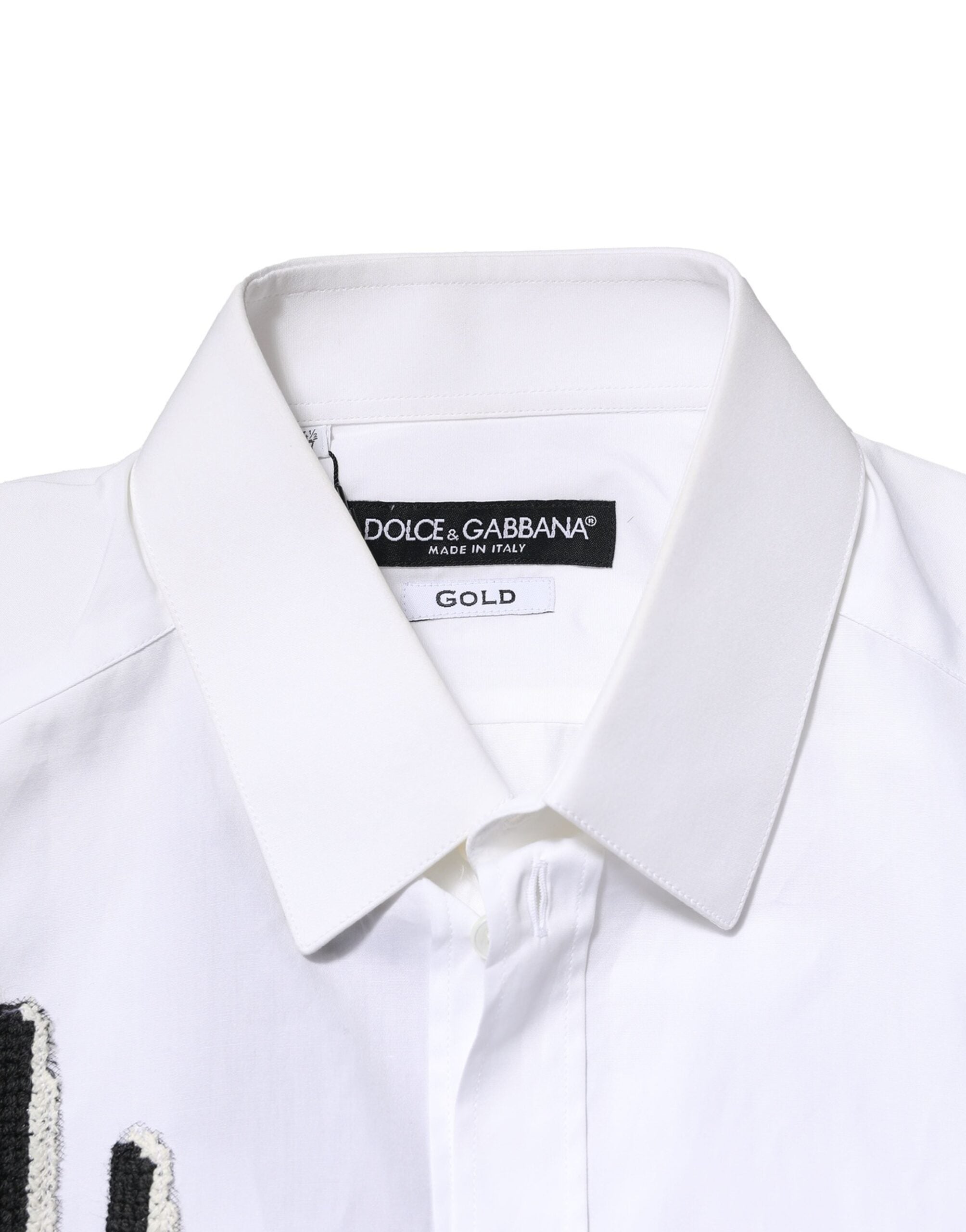 Chemise blanche Dolce & Gabbana avec broderie dorée et détails sophistiqués, vue de face.