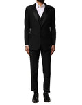 Costume trois pièces en laine noire Dolce & Gabbana, veste à simple boutonnage et pantalon assorti, élégant et sophistiqué.