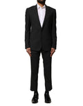 Costume deux pièces en laine noire Dolce & Gabbana, veste à boutons simple boutonnage et pantalon assorti, élégant et classique.