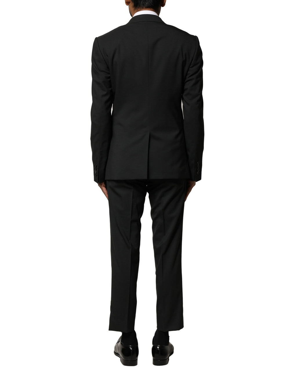Costume homme Dolce & Gabbana en laine noire à deux pièces, veste croisée à simple boutonnage et pantalon assorti.
