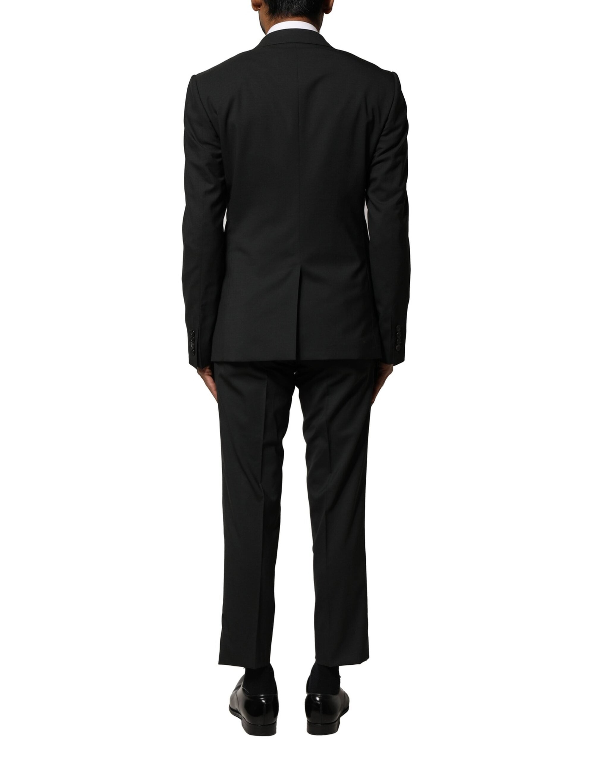 Costume homme Dolce & Gabbana en laine noire à deux pièces, veste croisée à simple boutonnage et pantalon assorti.