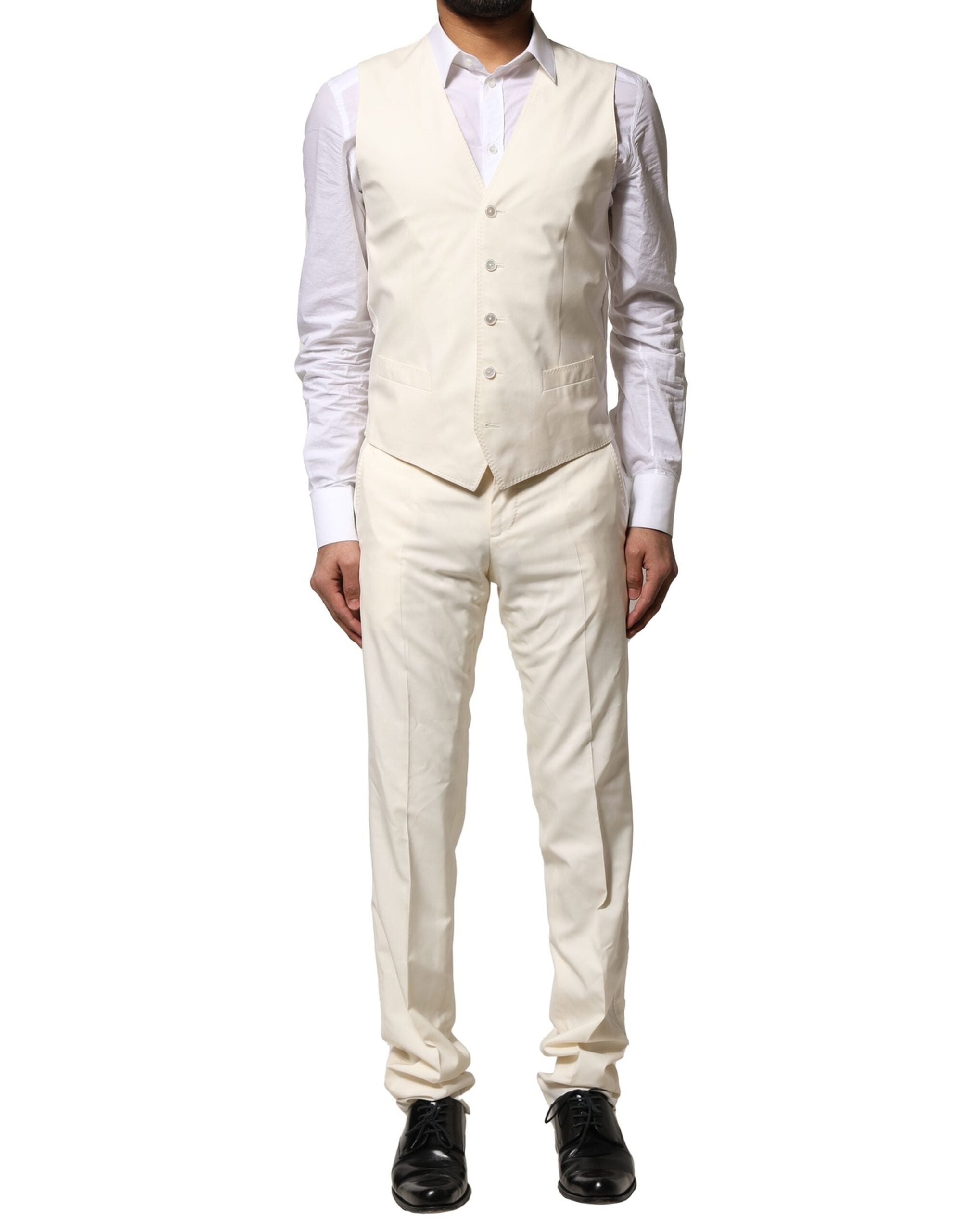 Costume en laine ivoire Dolce & Gabbana à trois pièces, veste à simple boutonnage, pantalon et gilet assortis.