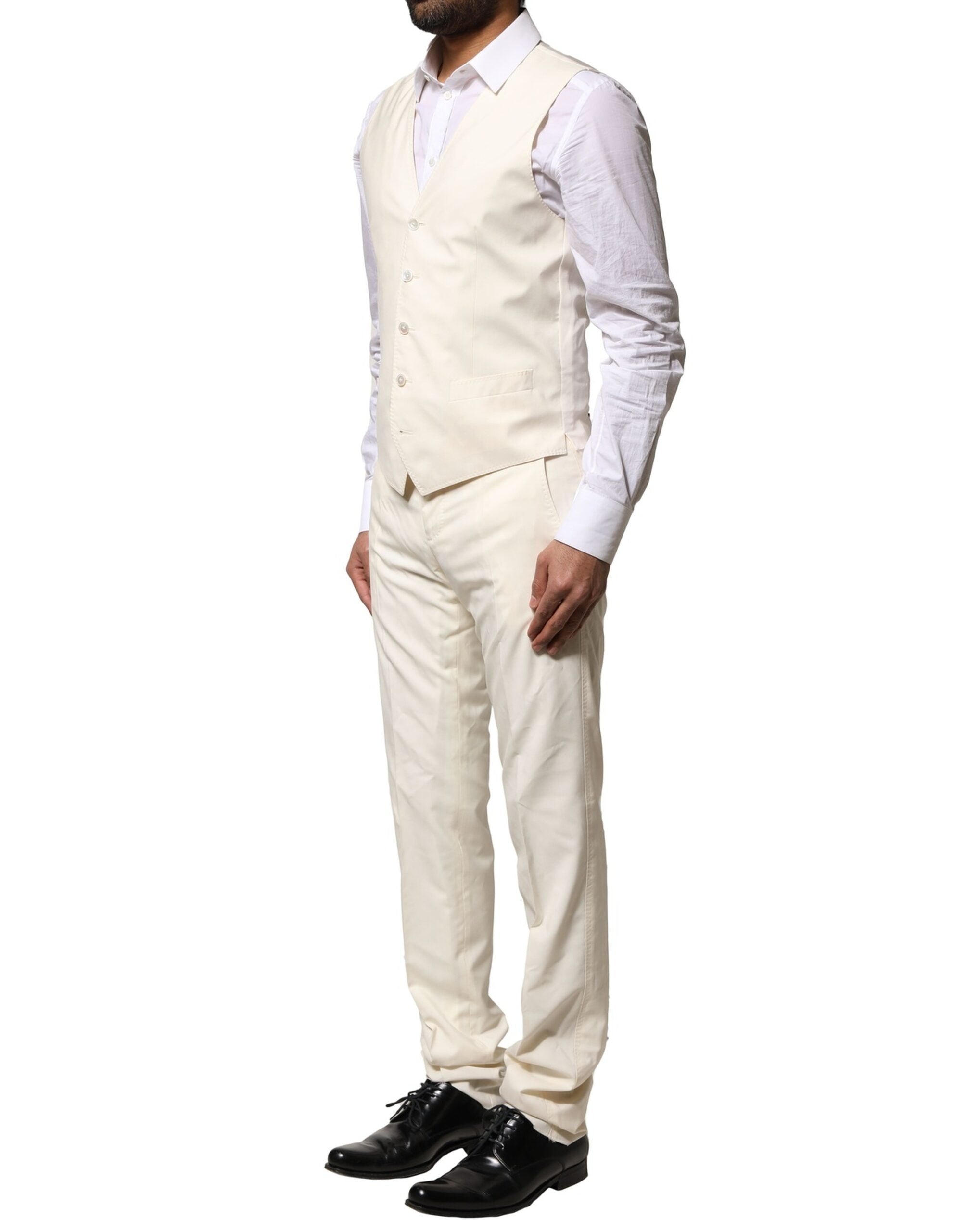 Costume en laine ivoire Dolce & Gabbana à 3 pièces, veste croisée simple boutonnage, pantalon et gilet assortis.