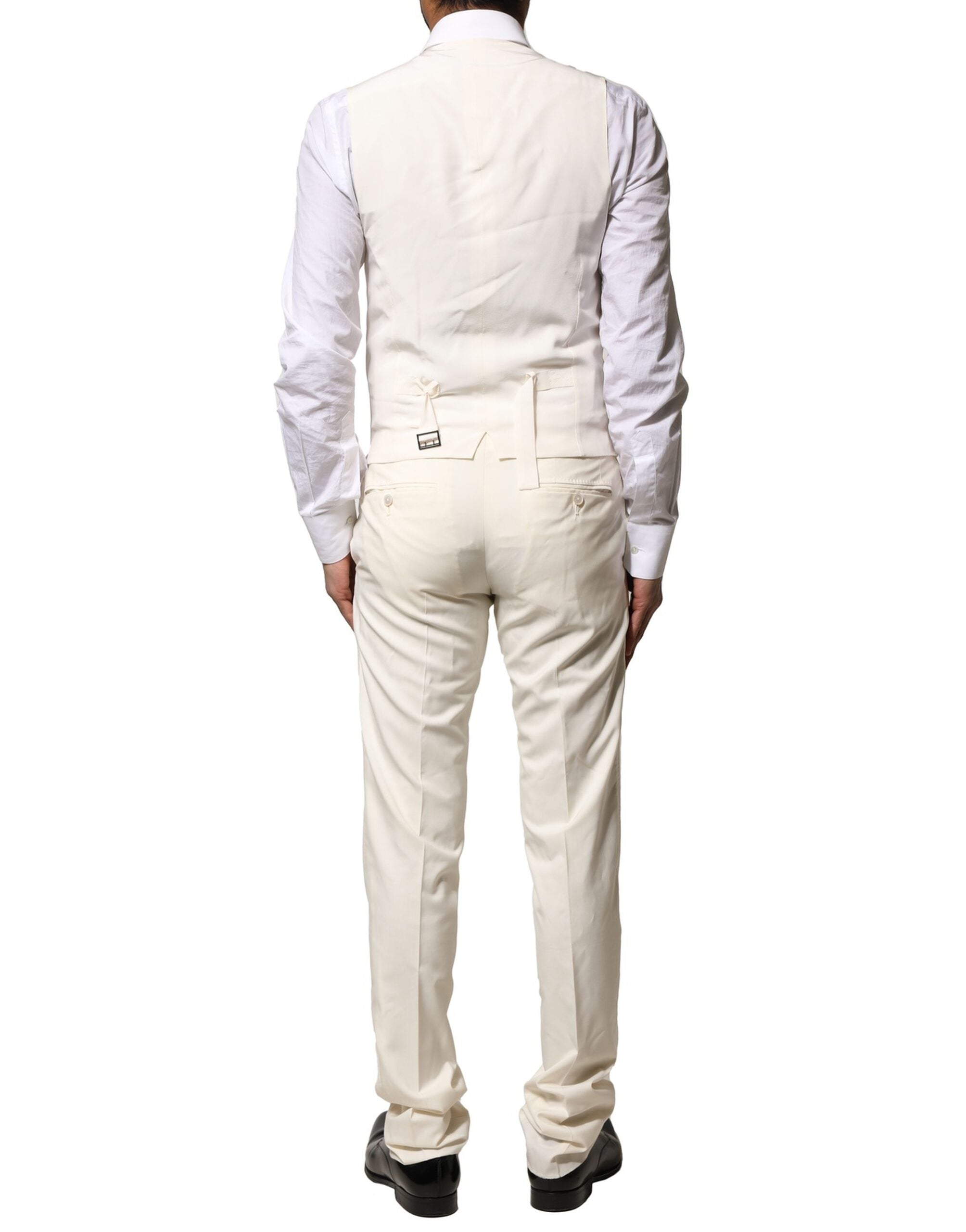 Costume en laine ivoire Dolce & Gabbana, 3 pièces, à simple boutonnage, élégant et sophistiqué, porté sur mannequin.