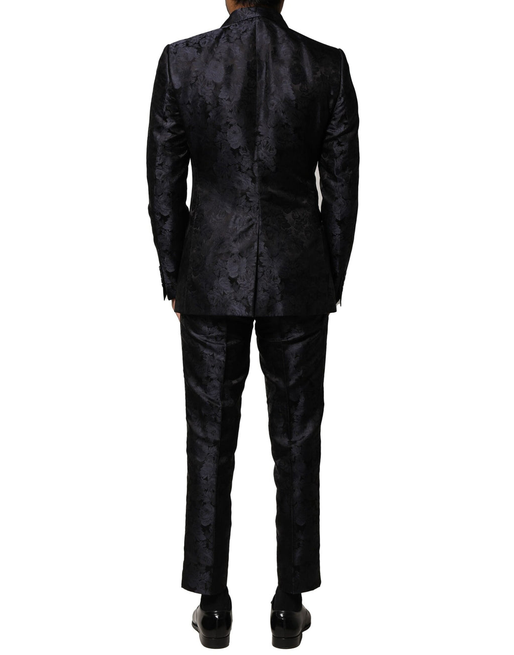 Costume noir Dolce & Gabbana en jacquard à trois pièces, avec veste à simple boutonnage et pantalon élégant.