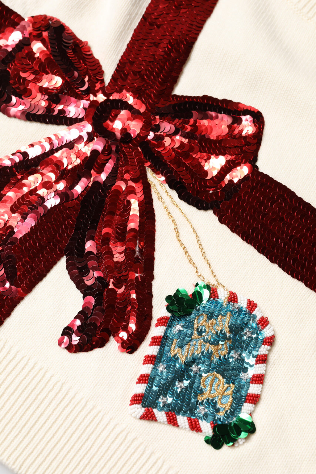 Pull à col rond Dolce & Gabbana blanc orné de sequins, pull-over élégant en maille avec détails brillants.