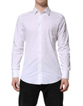 Chemise blanche Dolce & Gabbana en coton avec col, ornementée de détails dorés, élégante et sophistiquée.