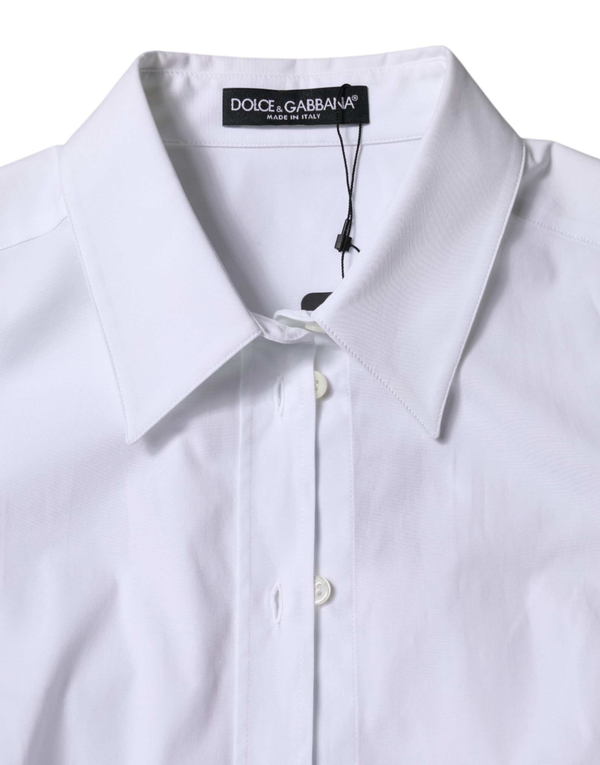 Chemise blanche en coton Dolce & Gabbana à col et manches longues, élégante et classique, visible avec détails de couture.