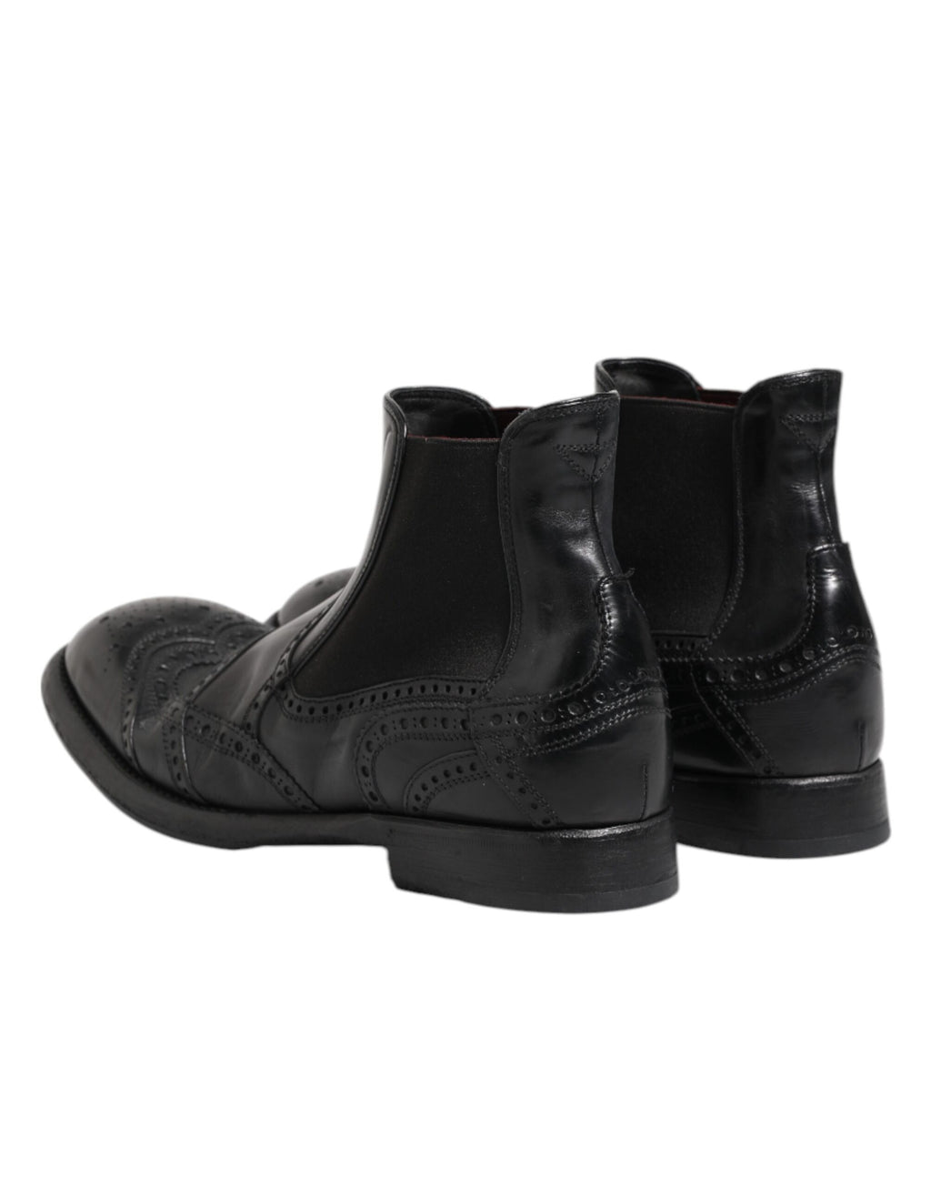 Bottes ankle en cuir noir Dolce & Gabbana, chaussures à enfiler élégantes avec semelle solide et finition soignée.