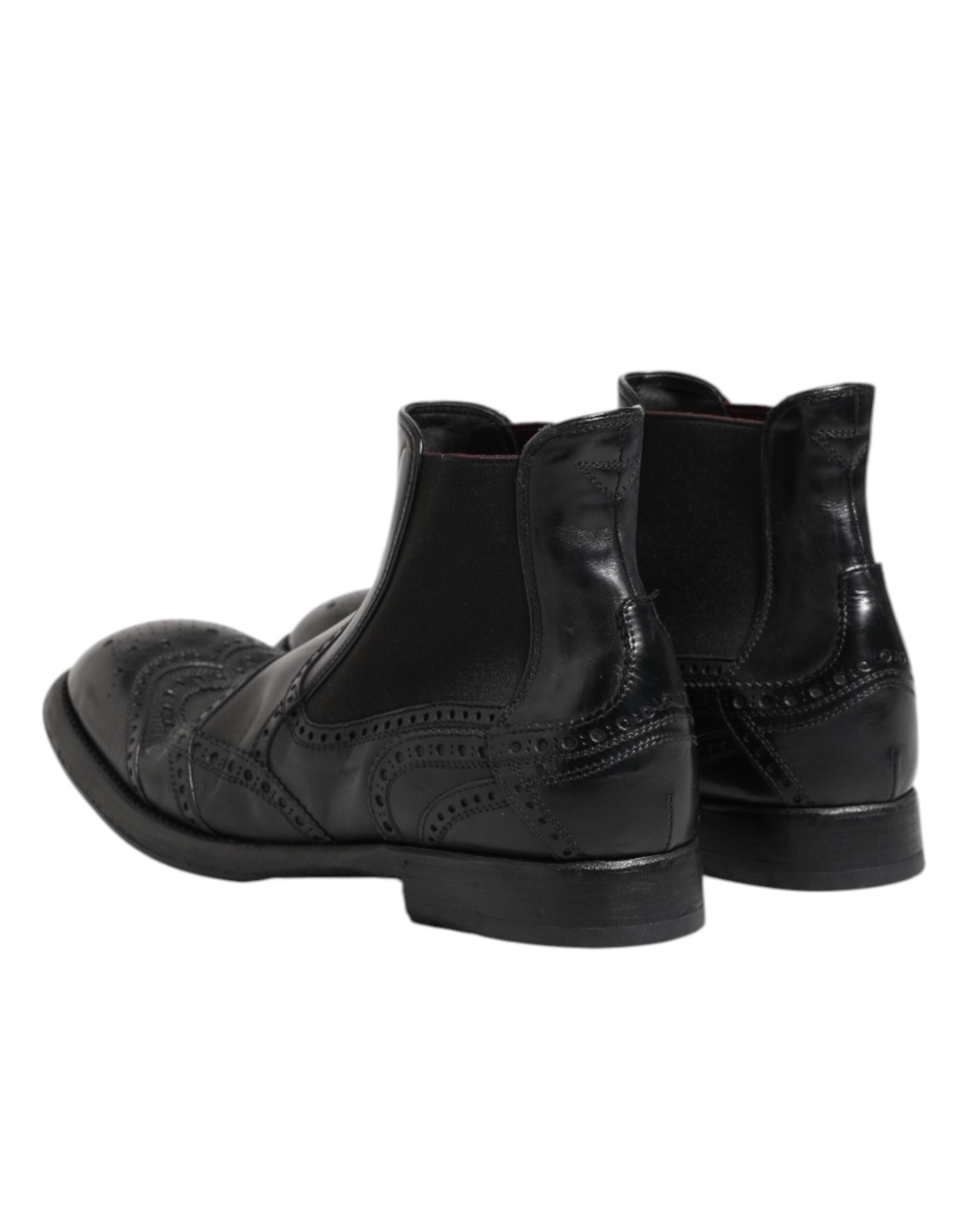 Bottes ankle en cuir noir Dolce & Gabbana, chaussures à enfiler élégantes avec semelle solide et finition soignée.
