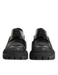 Chaussures de randonnée Derby en cuir verni noir Dolce & Gabbana, style élégant et robuste, avec lacets et semelle en caoutchouc.