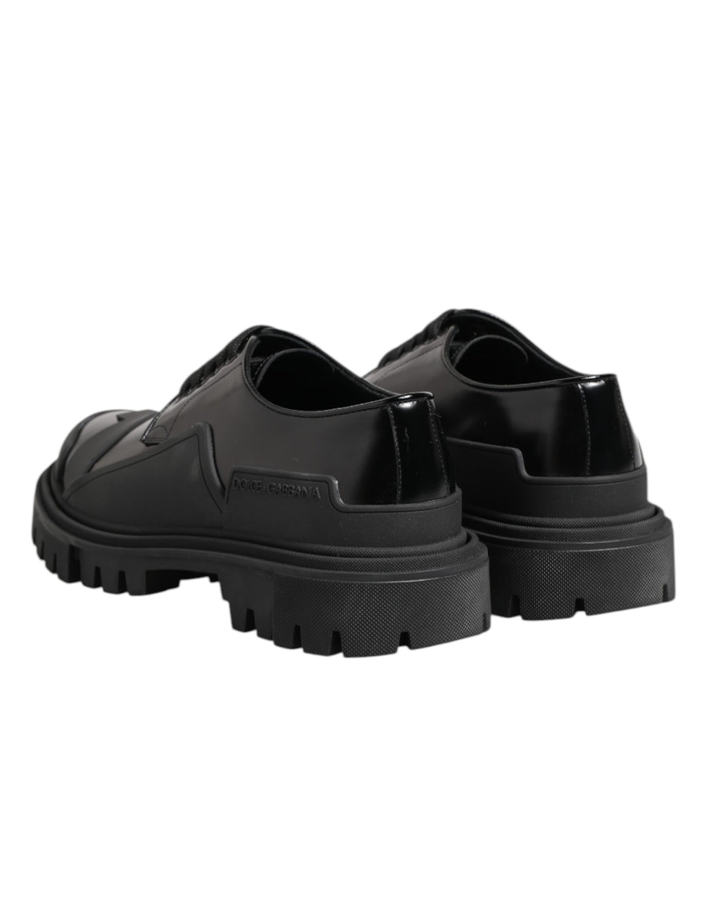 Chaussures de trekking Derby en cuir verni noir Dolce & Gabbana, style élégant et robuste, vues de face sur fond neutre.