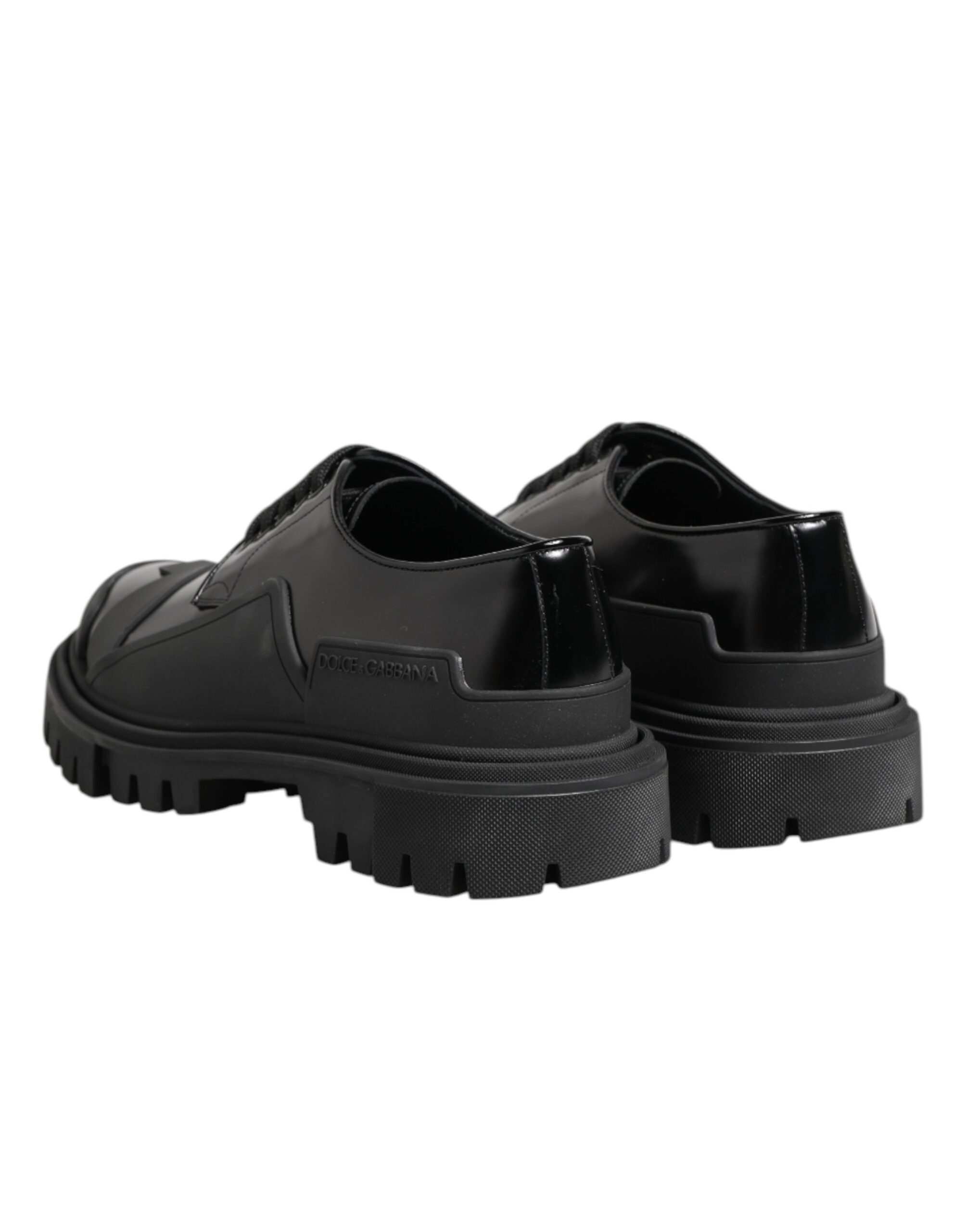 Chaussures de trekking Derby en cuir verni noir Dolce & Gabbana, style élégant et robuste, vues de face sur fond neutre.