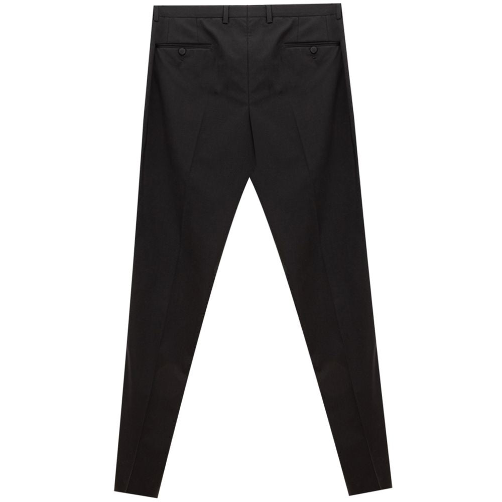 Pantalon noir en laine Dolce & Gabbana pour femme, coupe ajustée et élégante, visible sur une mannequine.