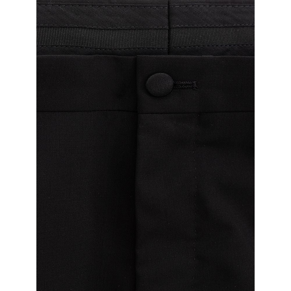 Pantalons en laine noire Dolce & Gabbana, pantalon de costume élégant pour homme, vue de face sur fond blanc.