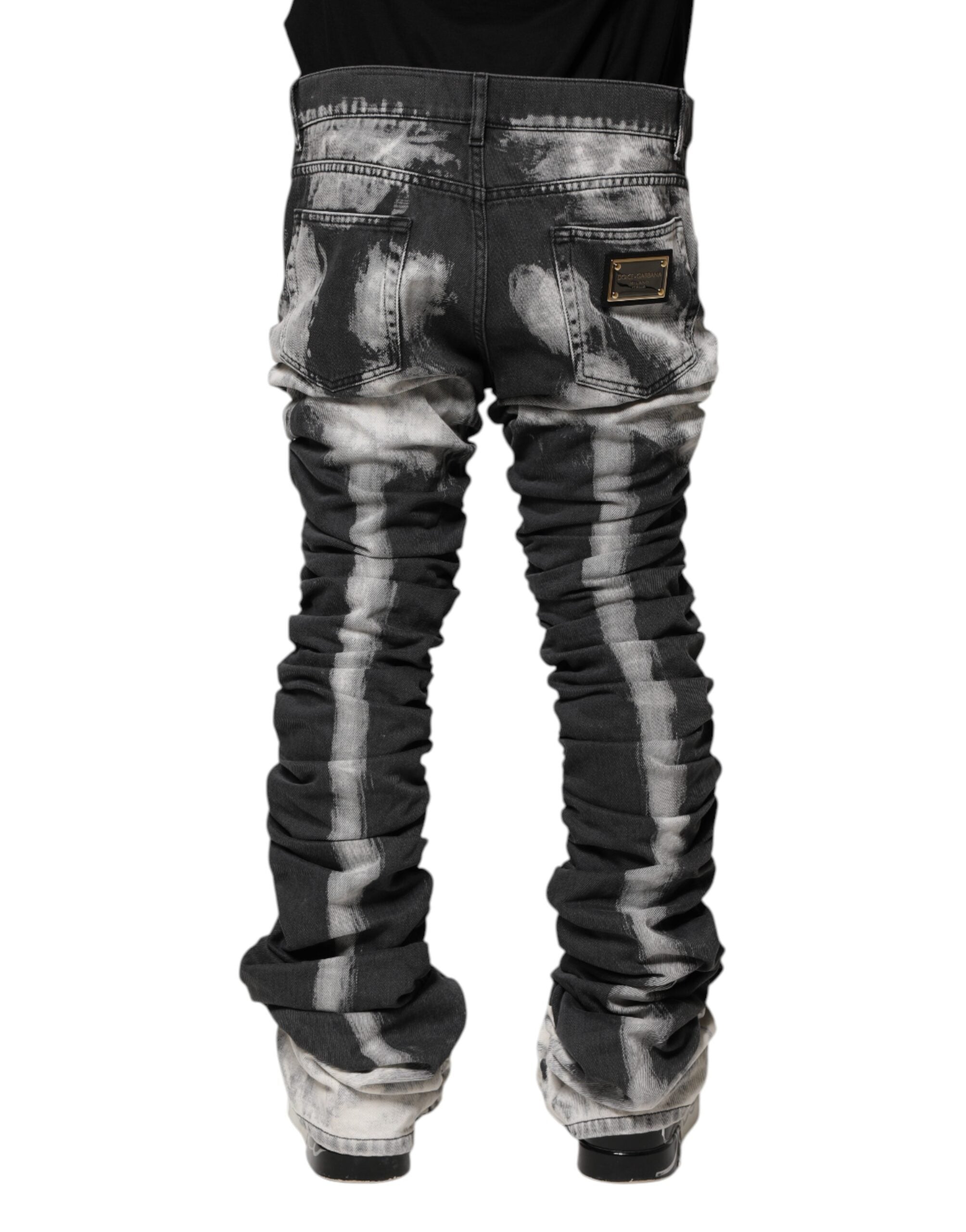 Jeans Dolce & Gabbana en denim droit à motif tie-dye noir, style décontracté et tendance.