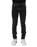 Jeans skinny en coton noir Dolce & Gabbana pour homme, coupe ajustée et moderne, visible détails de la texture en denim.