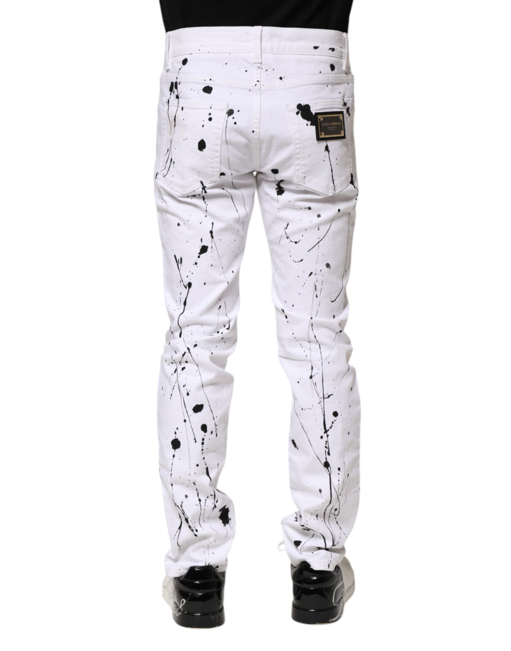 Jeans skinny en denim blanc Dolce & Gabbana avec motif ColorSplash, ajustés et modernes, visibles sur l'image.