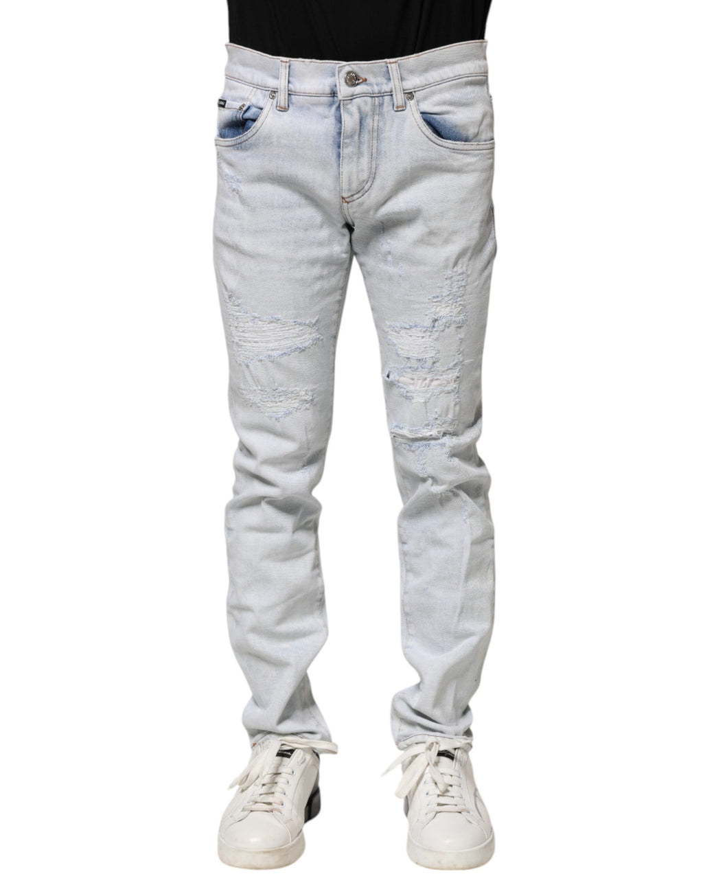 Jeans skinny déchirés en denim Light Blue de Dolce & Gabbana, style décontracté et tendance, visible en détail dans l’image.