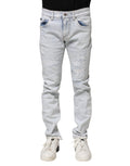 Jeans skinny déchirés en denim Light Blue de Dolce & Gabbana, style décontracté et tendance, visible en détail dans l’image.