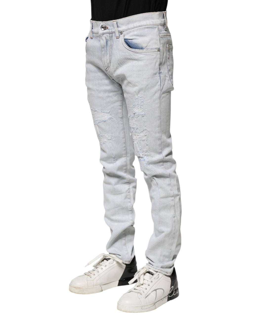 Jeans skinny en denim déchiré Light Blue de Dolce & Gabbana, style décontracté et tendance, visibles avec détails usés.