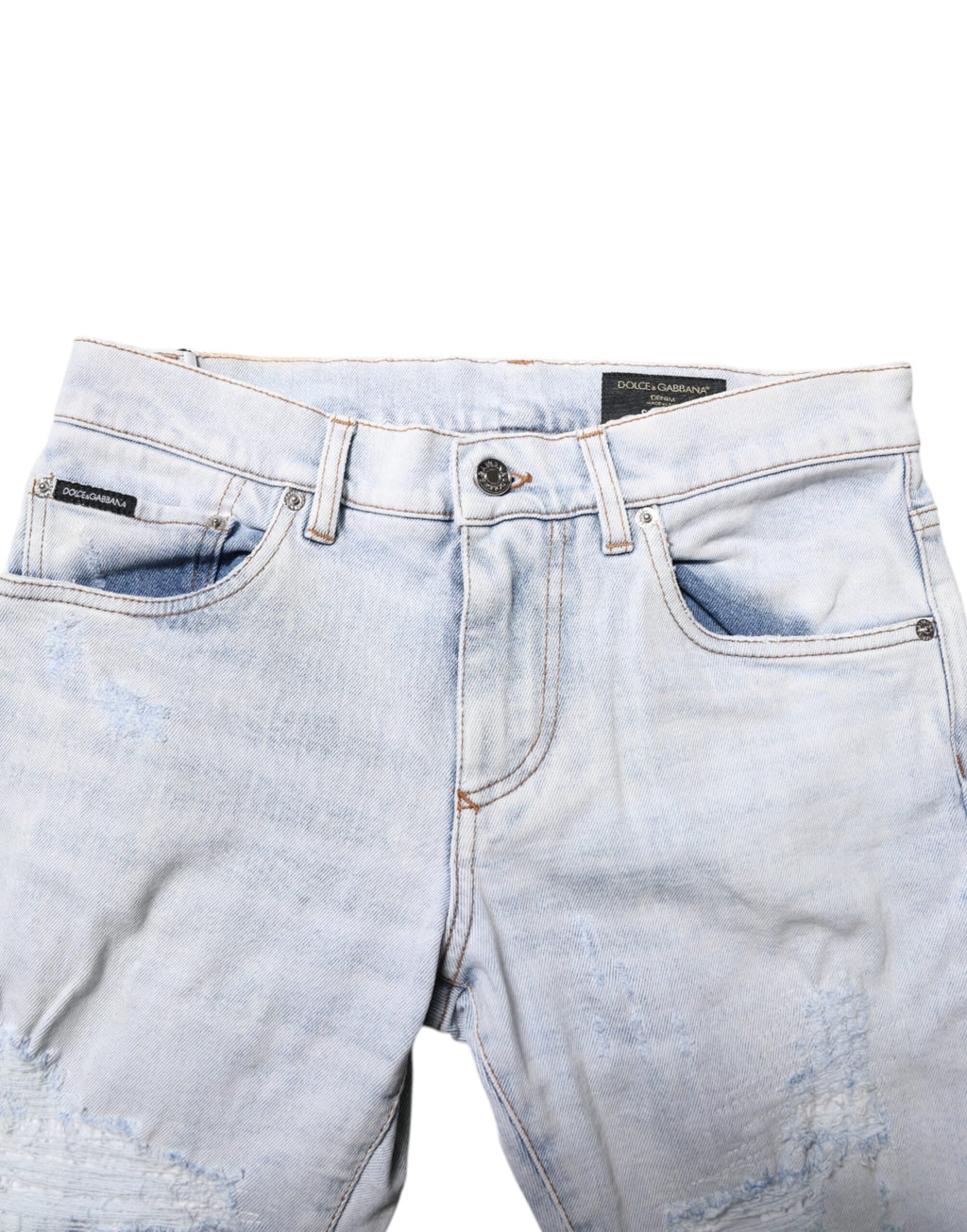 Jeans slim tachetés en denim déchiré Dolce & Gabbana Light Blue, coupe skinny, détails usés visibles.